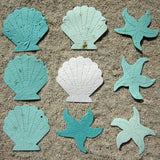 Recycled Ideas Favors aqua and white plantable paper shells and starfish