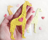 Recycled Ideas Favors plantable paper giraffes with mini hearts and cards