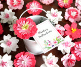 Recycled Ideas Favors pink poppies flower seed paper in a white tin pail