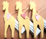 plantable paper giraffes with pink hearts
