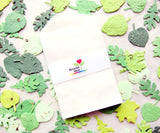 Recycled Ideas Favors glassine favor bags with plantable paper leaves