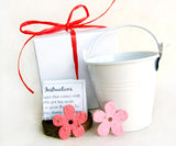 Recycled Ideas Favors plantable paper daisy favors with decorative pails and boxes