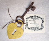 Recycled Ideas Favors plantable gold lock, brown key and tag