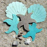 Recycled Ideas Favors aqua and gray plantable paper shells and starfish