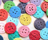 Recycled Ideas Favors plantable paper buttons in rainbow colors