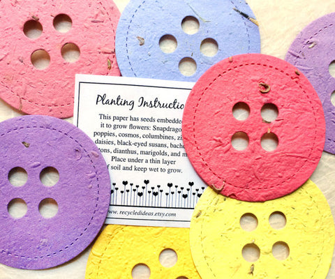 Recycled Ideas Favors plantable paper buttons in rainbow colors with card