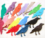 Recycled Ideas Favors plantable paper crows in rainbow colors