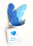 Recycled Ideas Favors plantable paper feathers with card and planter pail